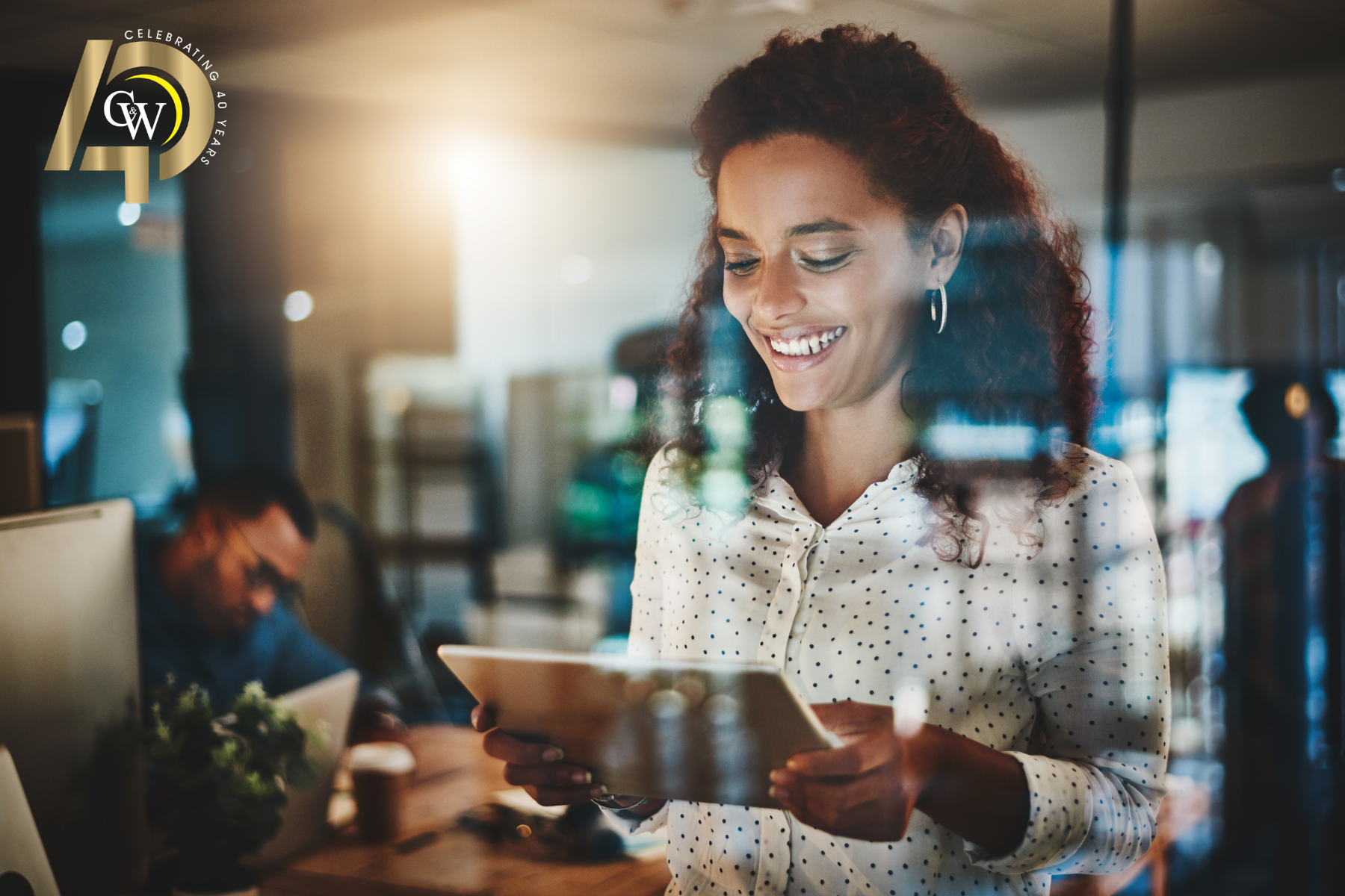 Businesswoman looking at tablet of predictions for technology in 2026