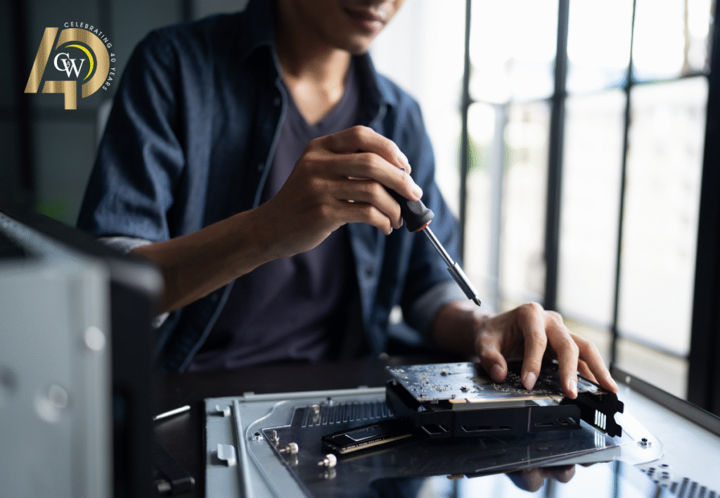Business IT Support Technician working on a computer