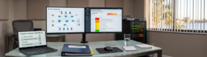 IT security dashboards and audit checklist on desk