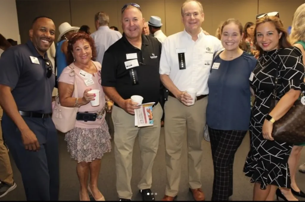 C&W Technologies staff networking at a Martin County business event.